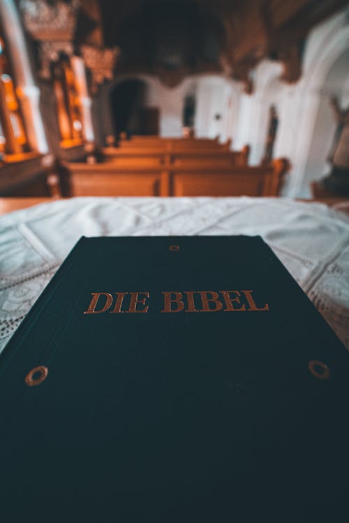 Free Close-up Photo of a Bible at the Altar Stock Photo
