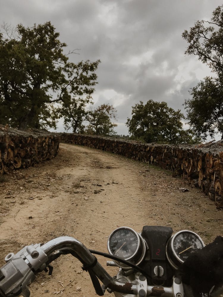 A Motorcycle Ride On An Unpaved Road