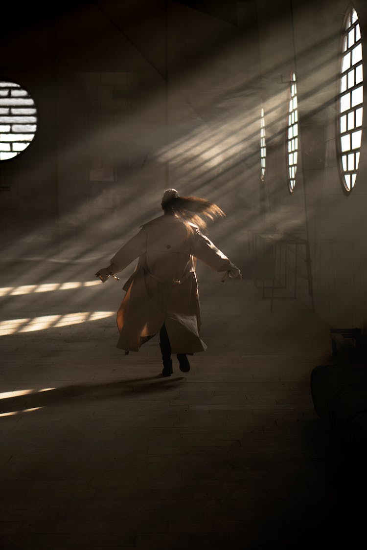 Woman In Long Coat Running