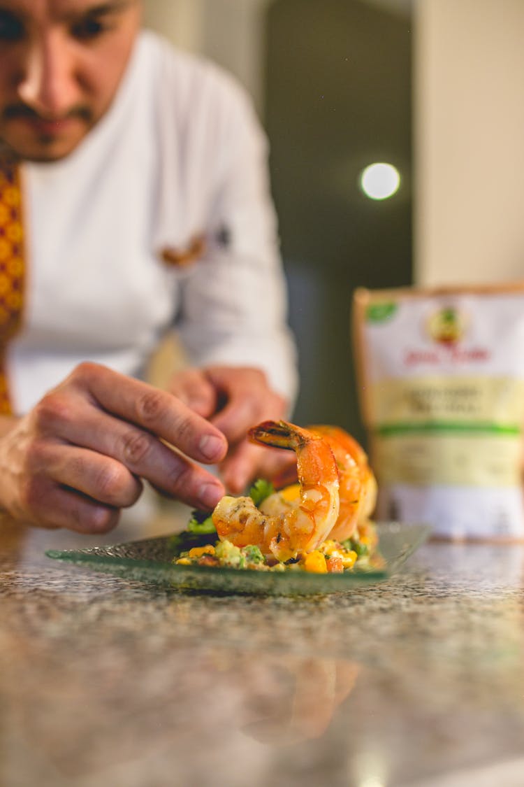 Close-Up View Of Chef Preparing Meal