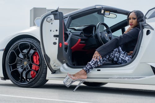 A Woman Getting Out of a Lamborghini