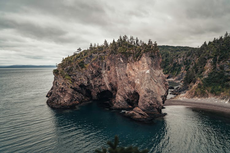 Arch Rock Formation Extending Towards Sea