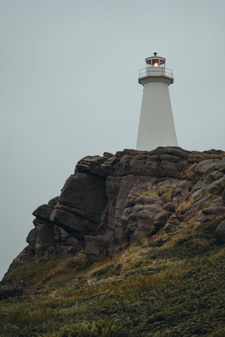 White Lighthouse On Top Of Limestone Rock Formation