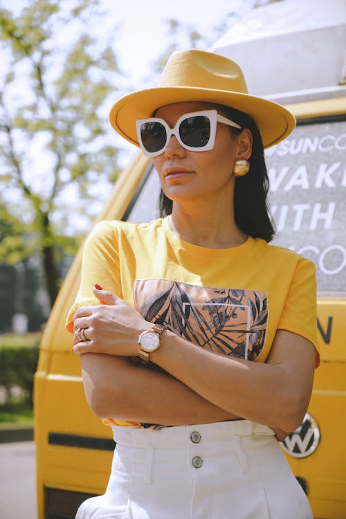Woman in Yellow Hat and Sunglasses