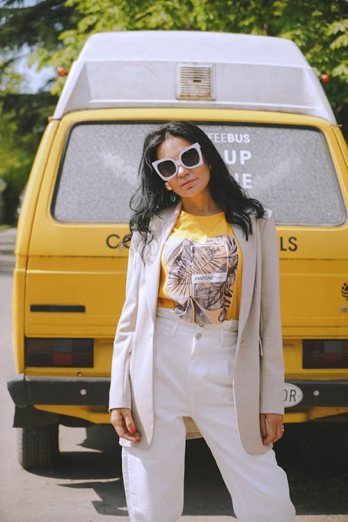 Woman Standing by Yellow Car