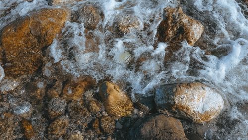 Free Close-up view of ocean waves crashing against rocks in Turkey's stunning coastline. Stock Photo