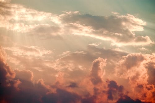 Free Sunlight Rays Shining through Clouds Stock Photo