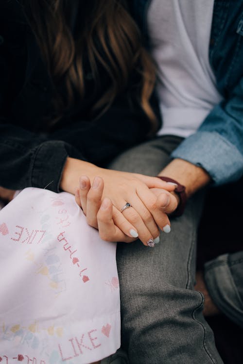 Close-up of Young Couple Holding Hands