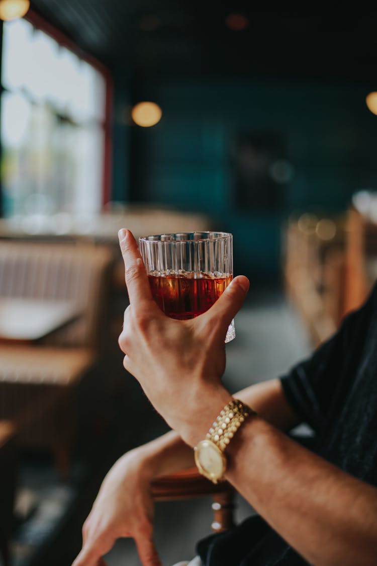 Close-up Of Mans Hand Holding Drink