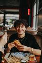 Portrait of Smiling Man at Restaurant Table