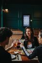 Friends Toasting at Restaurant Table