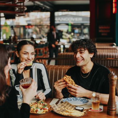 A beautifully set table with schnitzel and sides