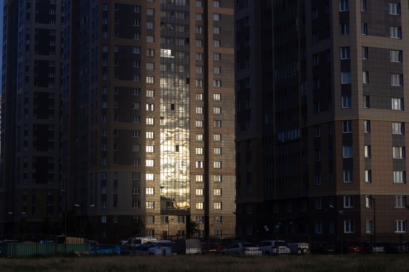 Residential tower catching low evening light — photo by Plato Terentev on Pexels