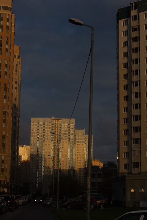 Free A cityscape featuring high-rise residential buildings under a dusky evening sky. Stock Photo