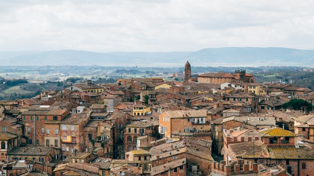 Discover the rustic charm and stunning rooftops of Asciano, Tuscany, Italy.