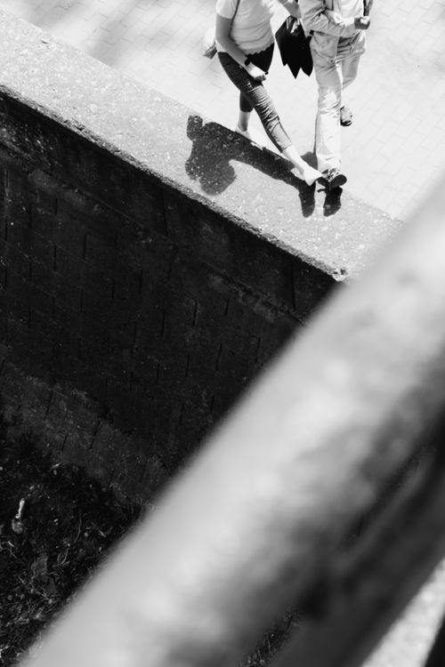 Free Dynamic black and white street photo capturing walking motion from above. Stock Photo