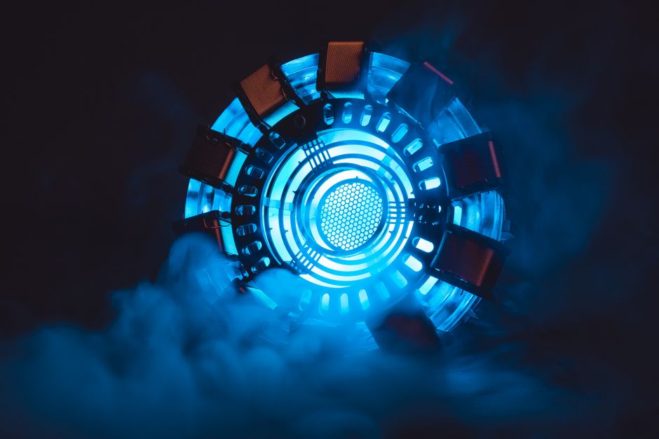 Close-up of a blue illuminated energy core with smoke, creating a sci-fi atmosphere.