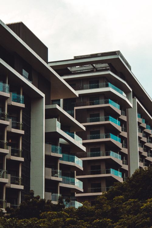 Free Contemporary residential buildings featuring striking modern architecture with glass balconies. Stock Photo