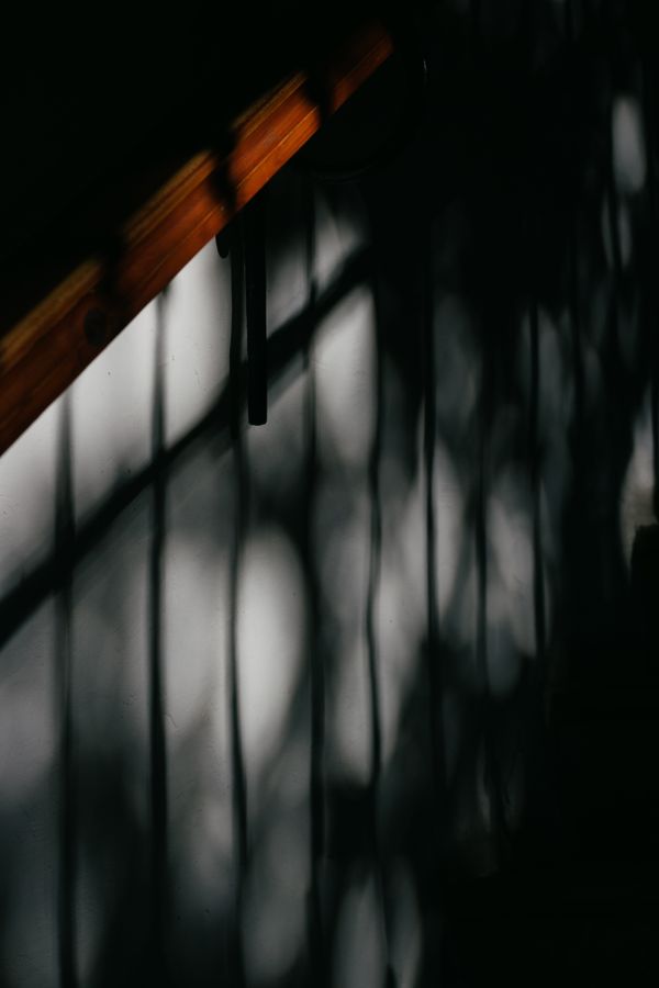 Abstract shadows on a stairwell wall — photo by Plato Terentev on Pexels