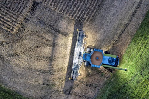 Blue Tractor Harvesting Crops