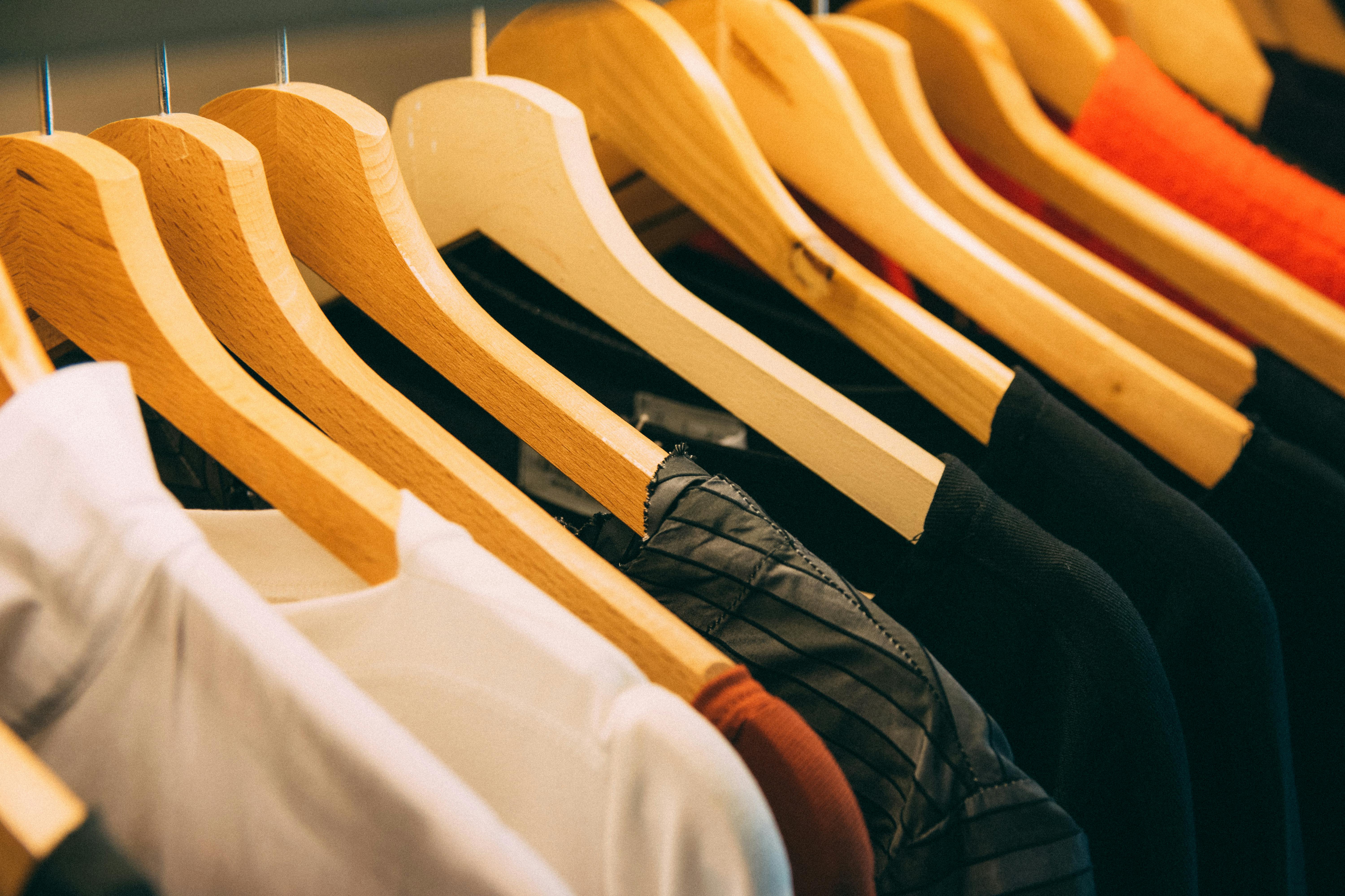 White T Shirt for Kids on Hangers in Clothing Store. Stock Image