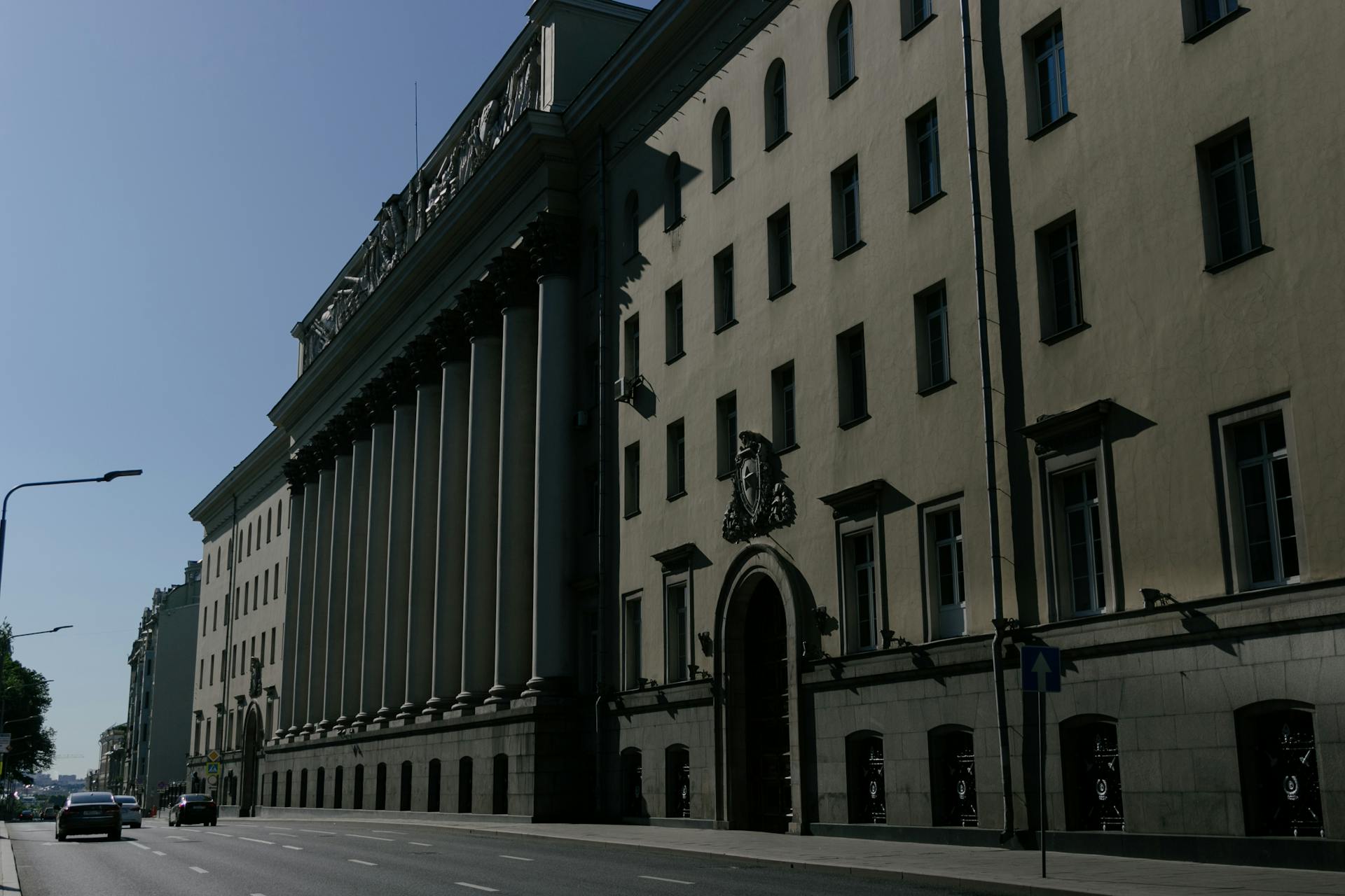 Elegant facade of a historic government building on a city street in Moscow, Russia.