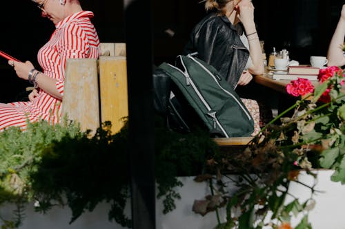 Closeup of People Sitting in an Outdoor Cafe