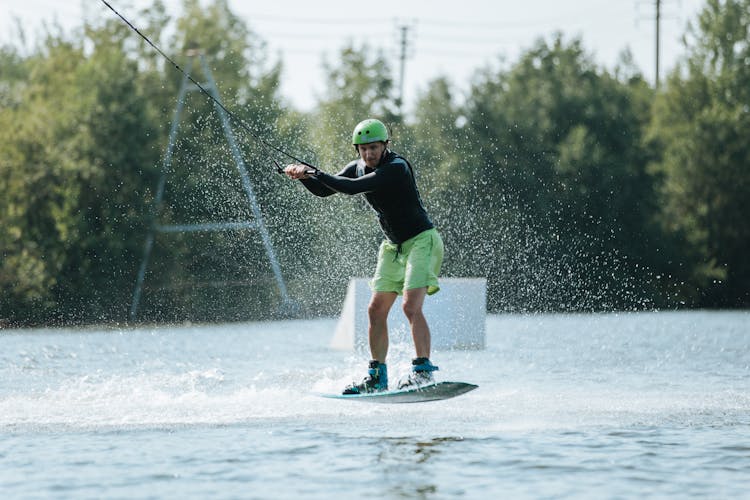 Wakeboarder And Blue Splashing Water