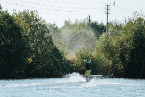 Male Wakeboarder in Blue Lake