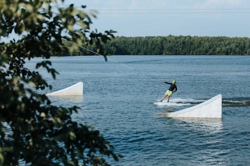 Man Wakeboarding in Blue Lake