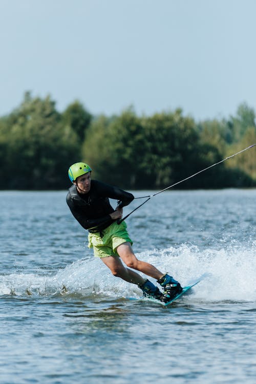 Man Wakeboarding in Lake