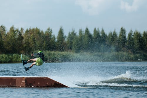 A Man Doing a Trick while Wakeboarding