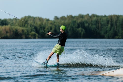 Man Wakeboarding in Blue Lake