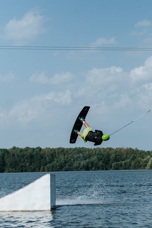 
A Man Doing a Trick while Wakeboarding