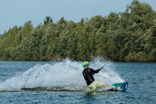 
A Man Doing a Trick while Wakeboarding