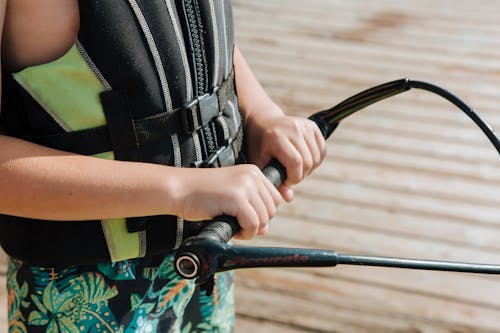 Close-up of Boy Holding Wakeboarding Handle