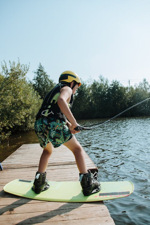 Boy on Wakeboard on Jetty