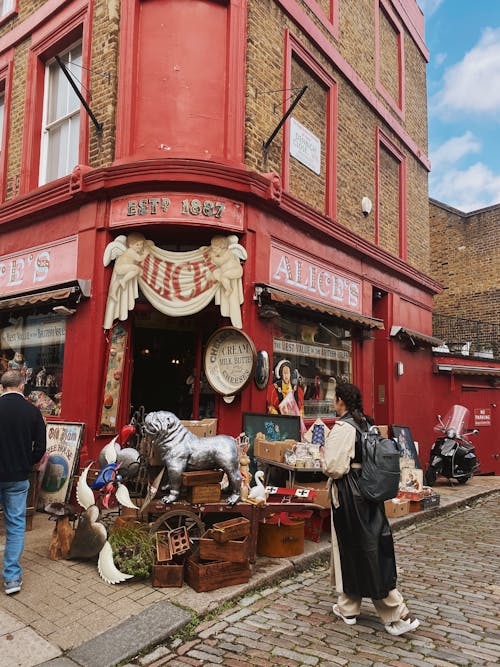 People outside an Antique Shop