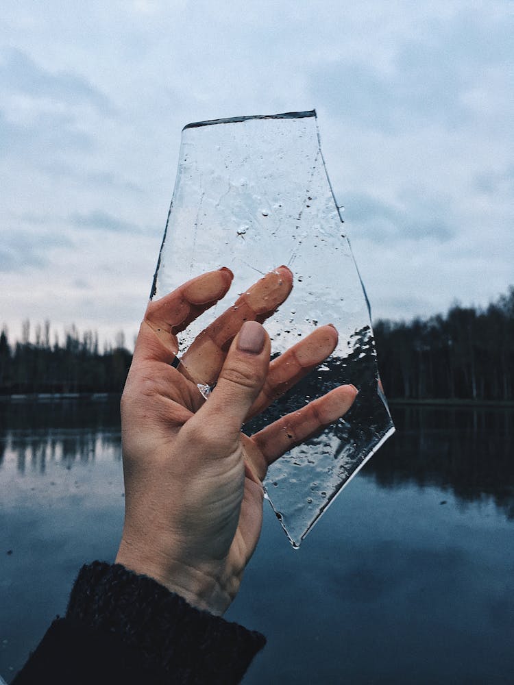 A Person Holding Clear Ice