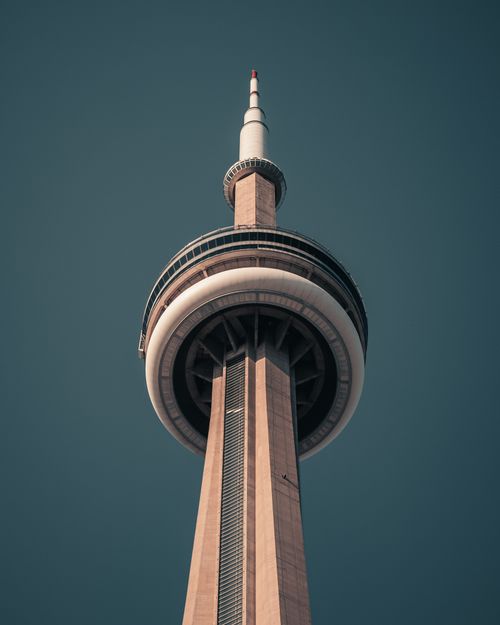 Free Low angle view of the CN Tower in Toronto, showcasing its architectural grandeur. Stock Photo
