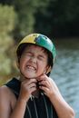 Boy Taking Off Safety Helmet