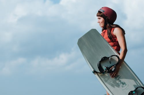 Portrait of Woman Holding Wakeboard