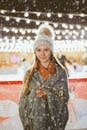 Teenage Girl in Winter Outfit with LED Lighting Wrapped Around Arms
