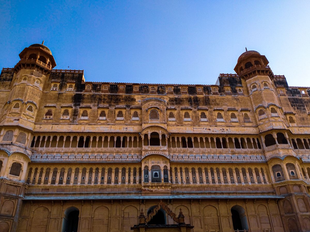 Junagarh Fort facade in Bikaner, Rajasthan under a clear blue sky