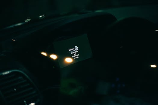 A close-up view of a car's dashboard display showing start instructions.