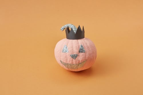 Pink Pumpkin with a Glittery Jack O Lantern Design and Black Paper Crown