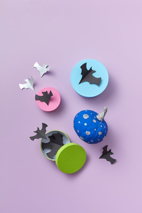 Paper Halloween Decoration with Bats and Pumpkin on Lilac Background