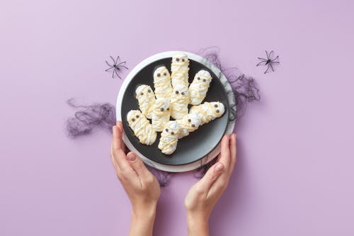 A Person Holding a Bowl of Halloween Dessert