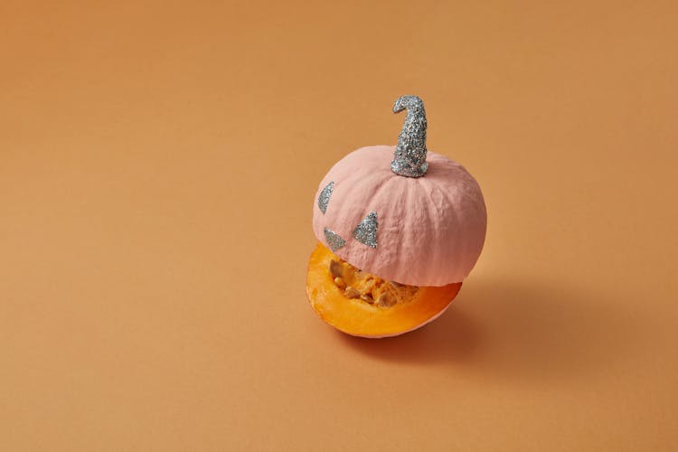 Mini Pumpkin With A Glittery Jack O Lantern Design