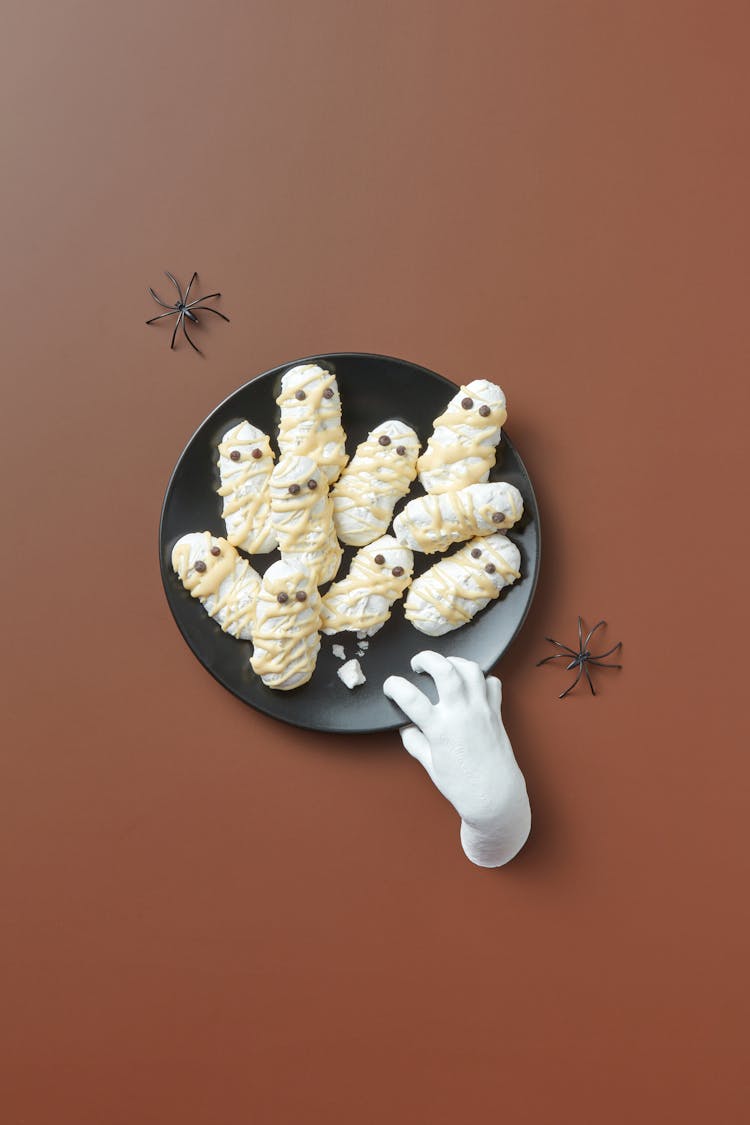 A White Fake Hand On A Halloween Dessert Plate